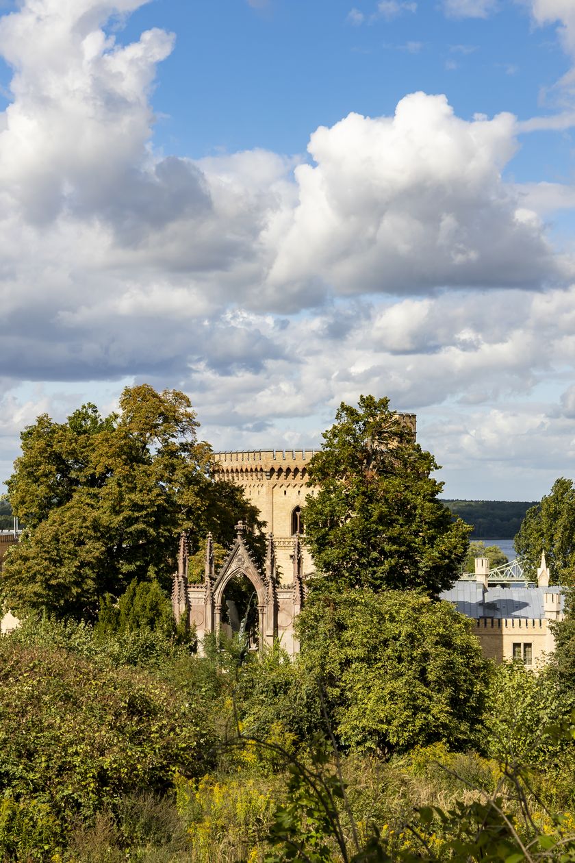 Babelsberg Palace nestled in the green trees of Babelsberg Park in summer