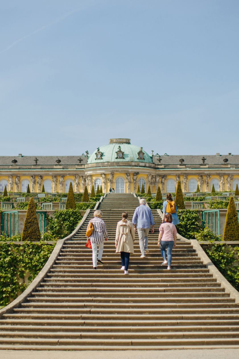 Group of people on the steps in front of Sanssouci Palace in Sanssouci Park in summer