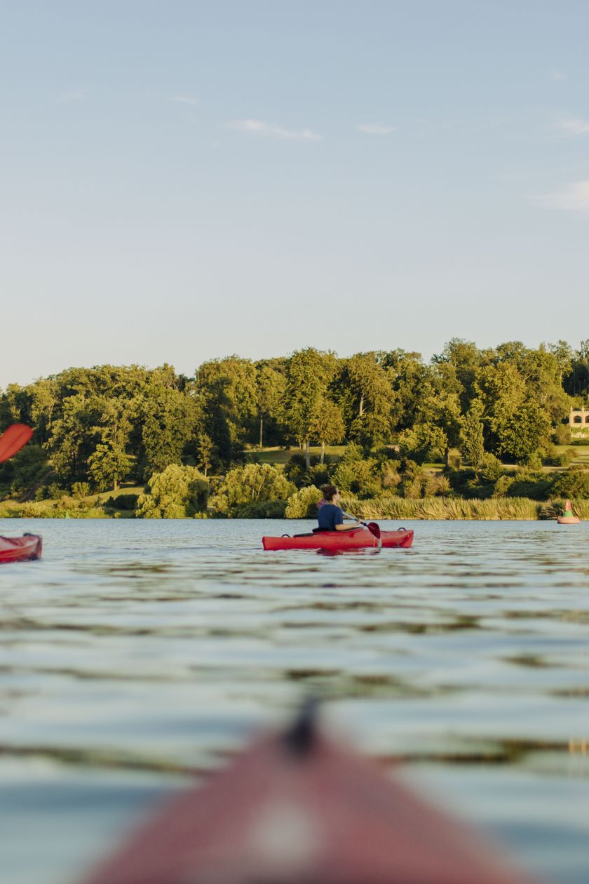 Canoes on the Havel River with Babelsberg Palace and Park in the background in summer