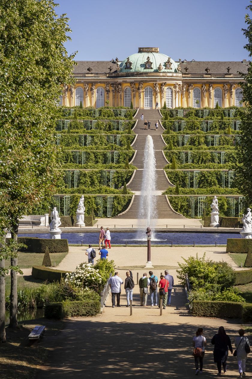 View of Sanssouci Palace, fountain and vineyard terraces in summer